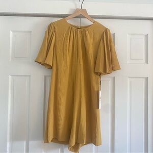Calvin Klein Mustard new with tags romper with bell sleeves
